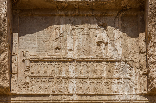 PLATE II. The tomb of Darius I at Naqš-e Rostam, top register. Photograph by Diego Delso, delso.photo, licensed under CC-BY-SA.