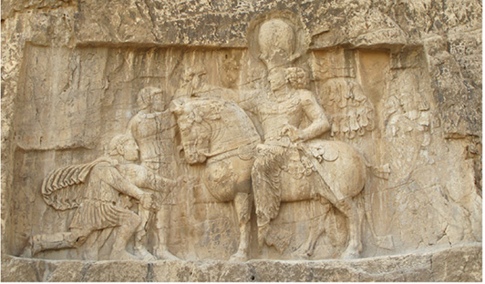 PLATE I. Relief of Šāpur I at Naqš-e Rostam. Photograph by Ali Mousavi.