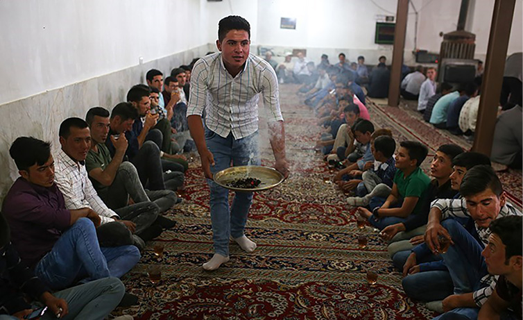Plate I. Burning wild rue (esfand) at a wedding reception at a Kurmānji village in North Khorasan province. Photograph by Ḥāmed Jaʿfarnejād, Tasnim News. Licensed under Creative Commons Attribution 4.0 International.