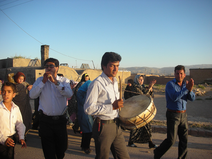 Plate I. A group of ʿāšeqs: Qeli Ḵošnavāz, dohol, and Pir ‘Ali Šākeri, qošma, at a wedding ceremony in Almājoq, July 2010. Photograph by and courtesy of the author.
